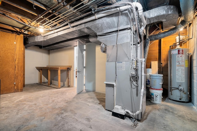 basement featuring heating unit and gas water heater