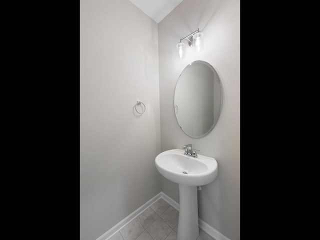 bathroom with tile patterned floors