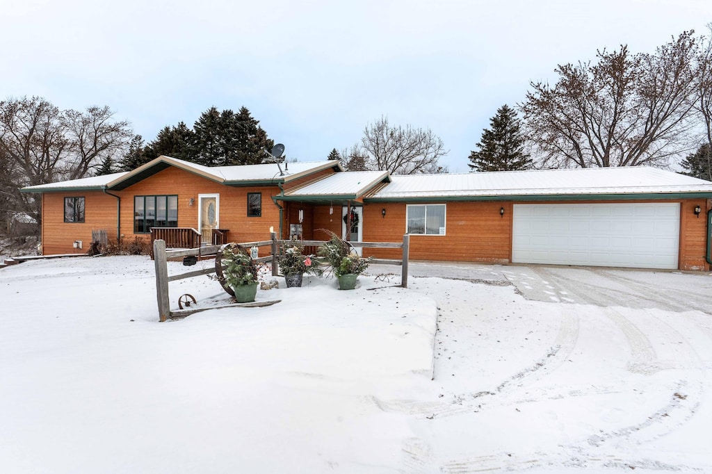 ranch-style home featuring a garage