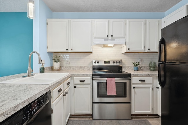 kitchen with hanging light fixtures, sink, white cabinets, and black appliances