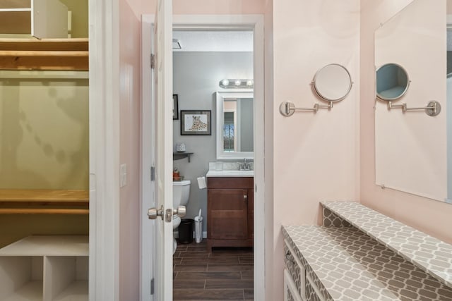 bathroom with vanity, a textured ceiling, and toilet