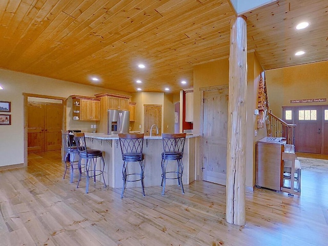 16694 206th Cir, Hutchinson, MN 55350 - kitchen with stainless steel refrigerator with ice dispenser, wood ceiling, light wood-style flooring, a peninsula, and a kitchen breakfast bar