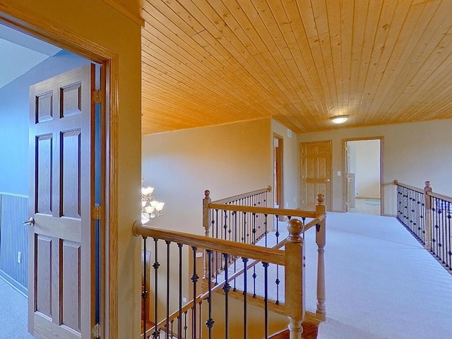 16694 206th Cir, Hutchinson, MN 55350 - hall featuring an upstairs landing, wooden ceiling, carpet flooring, and a chandelier
