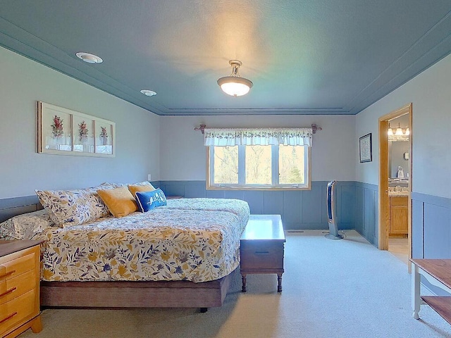 16694 206th Cir, Hutchinson, MN 55350 - bedroom featuring a wainscoted wall, light carpet, and ensuite bath