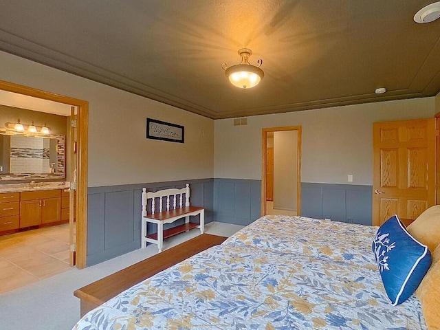 16694 206th Cir, Hutchinson, MN 55350 - bedroom with a wainscoted wall, ensuite bathroom, and crown molding