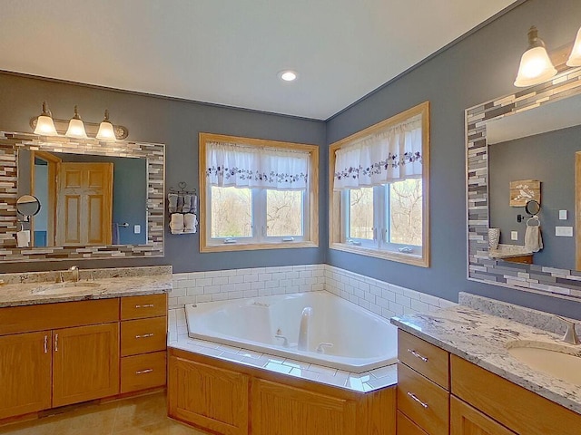 16694 206th Cir, Hutchinson, MN 55350 - bathroom featuring a jetted tub, two vanities, and tile patterned floors
