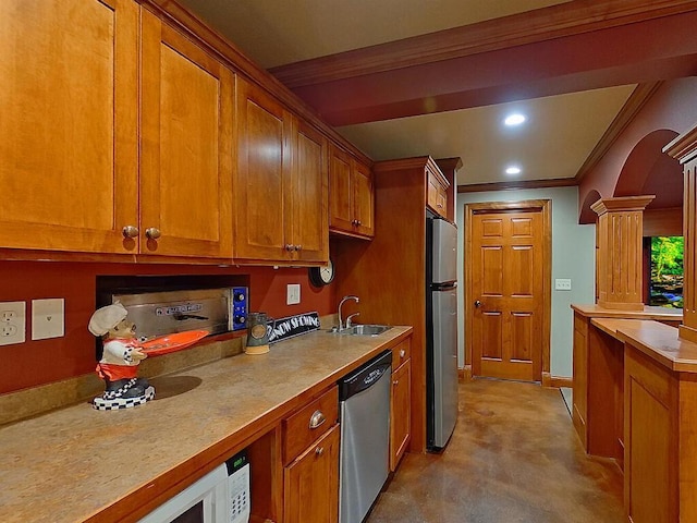 16694 206th Cir, Hutchinson, MN 55350 - kitchen with stainless steel appliances, brown cabinets, a sink, ornamental molding, and concrete flooring
