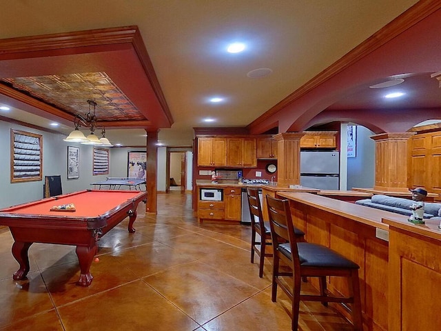 16694 206th Cir, Hutchinson, MN 55350 - recreation room with ornate columns, arched walkways, ornamental molding, light tile patterned floors, and a tray ceiling