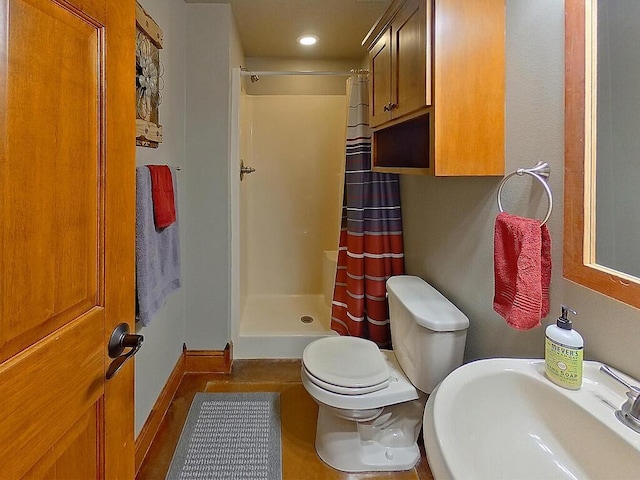 16694 206th Cir, Hutchinson, MN 55350 - bathroom featuring a sink, a shower stall, toilet, baseboards, and recessed lighting