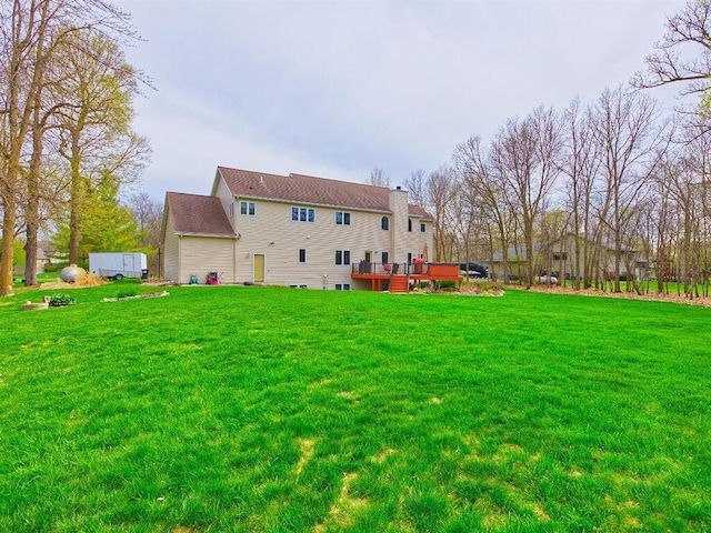 16694 206th Cir, Hutchinson, MN 55350 - back of house featuring a chimney, a yard, and a deck