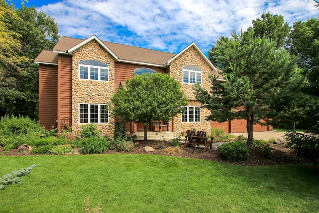16694 206th Cir, Hutchinson, MN 55350 - back of property with stone siding, a yard, and a garage