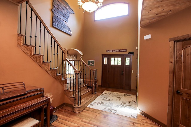 16694 206th Cir, Hutchinson, MN 55350 - entrance foyer with a towering ceiling, stairs, healthy amount of natural light, wood finished floors, and a chandelier