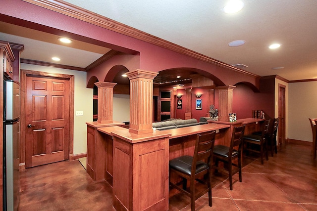 16694 206th Cir, Hutchinson, MN 55350 - indoor dry bar with ornate columns, ornamental molding, recessed lighting, freestanding refrigerator, and arched walkways
