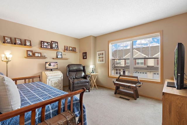 carpeted bedroom featuring visible vents, a textured ceiling, and baseboards