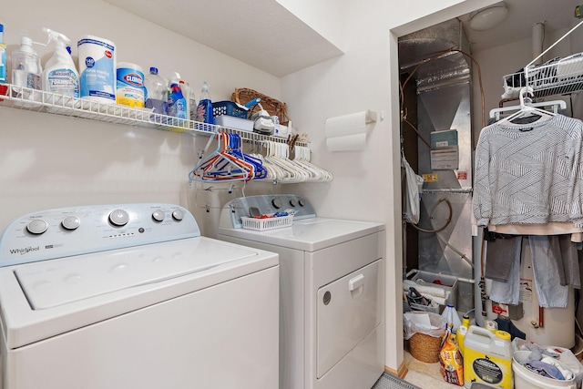 laundry area with laundry area and separate washer and dryer