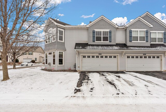 view of front of house featuring a garage and aphalt driveway