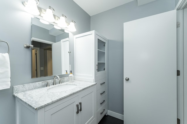 bathroom featuring vanity and baseboards