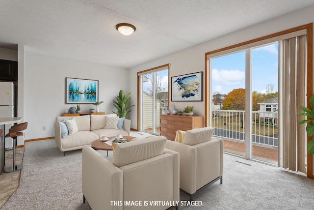 living room with light colored carpet and a textured ceiling