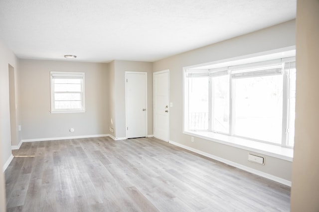 spare room with light hardwood / wood-style floors