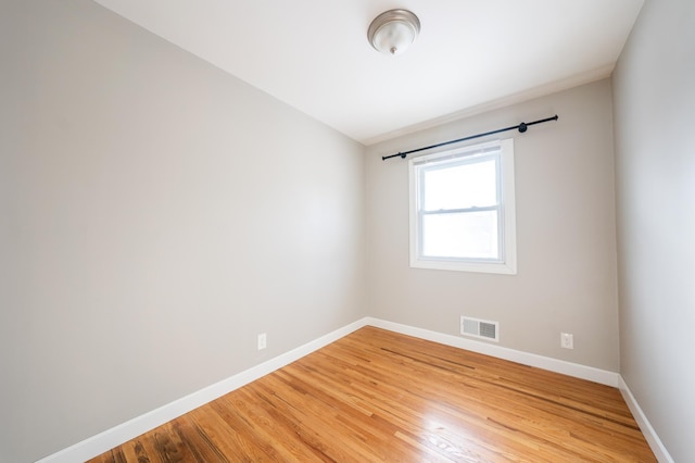 spare room featuring hardwood / wood-style flooring