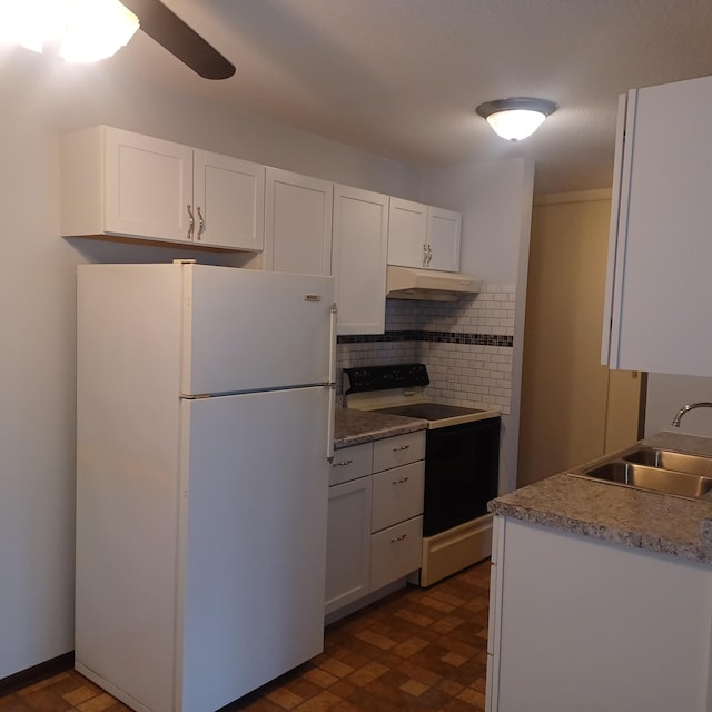 kitchen with sink, white cabinets, decorative backsplash, white fridge, and electric range