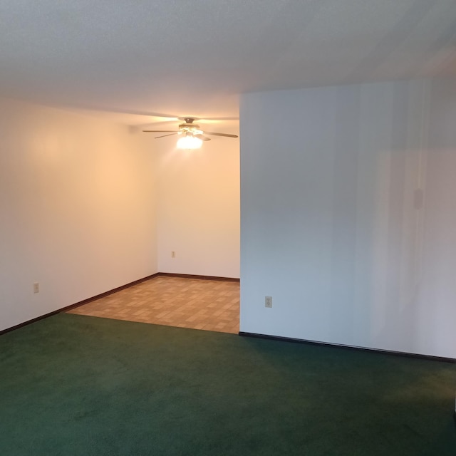 empty room featuring ceiling fan and light parquet floors