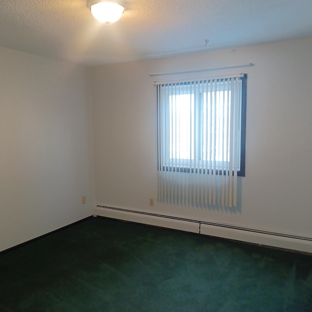 unfurnished room featuring dark carpet, a baseboard radiator, and a textured ceiling