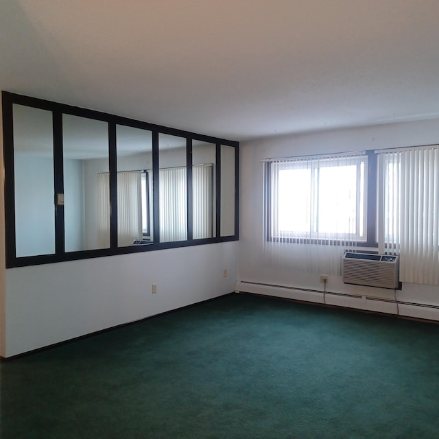 carpeted empty room with a baseboard radiator