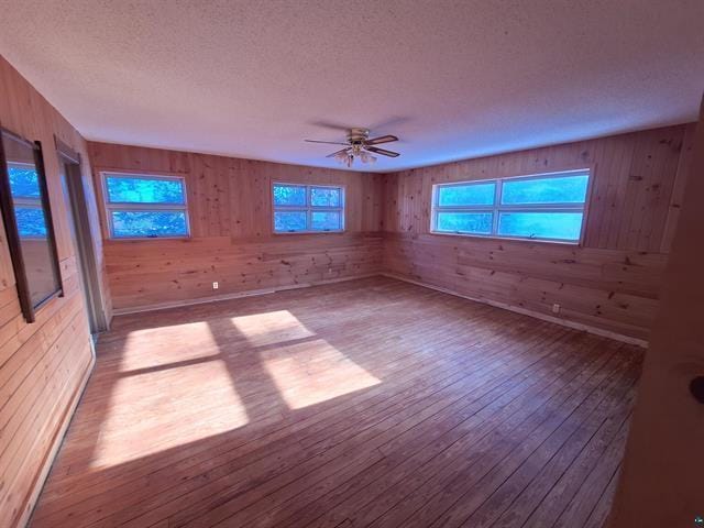 6330 Mitchell Rd, Hughes Twp, WI 54847 - spare room featuring a textured ceiling, ceiling fan, and light hardwood / wood-style floors