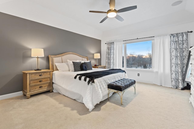 bedroom with ceiling fan and light carpet