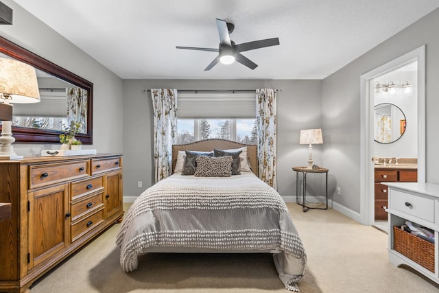 carpeted bedroom featuring ceiling fan and connected bathroom