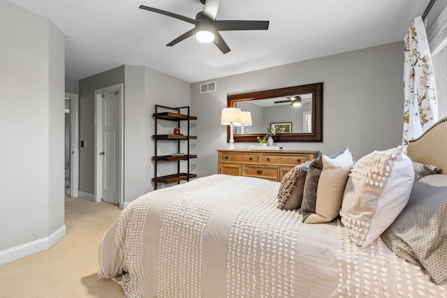 bedroom with light carpet and ceiling fan