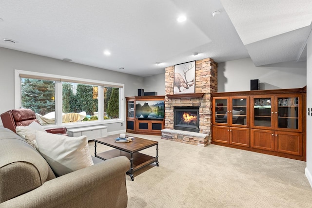 carpeted living room featuring a fireplace