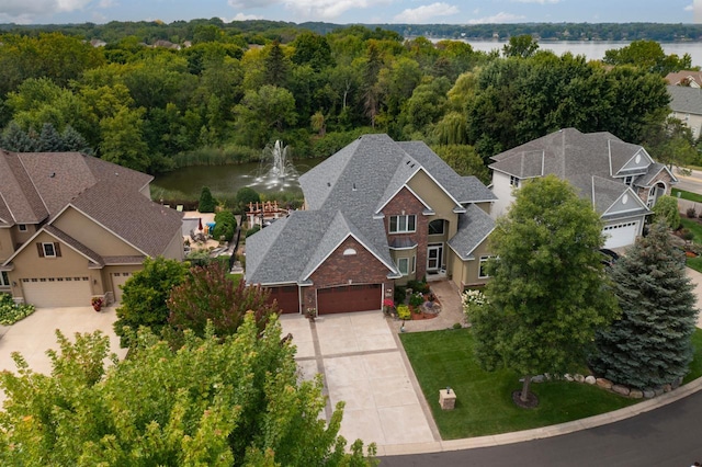 drone / aerial view featuring a water view