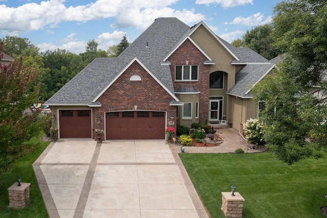 craftsman house featuring a front yard and a garage