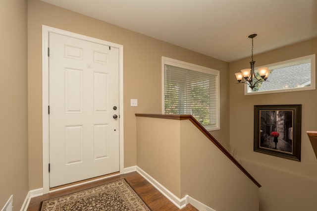 entrance foyer featuring a chandelier and hardwood / wood-style floors