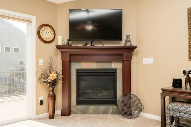 details featuring a fireplace and carpet floors