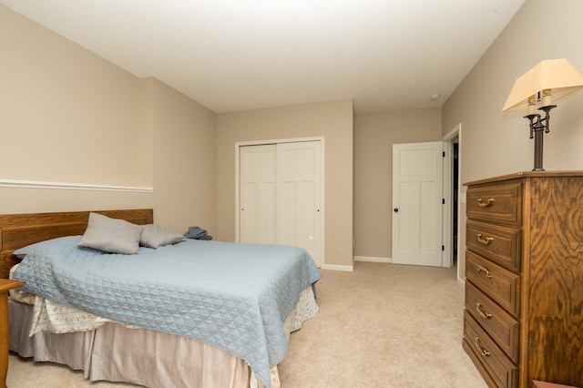 carpeted bedroom featuring a closet