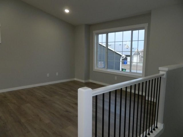 stairway featuring wood-type flooring