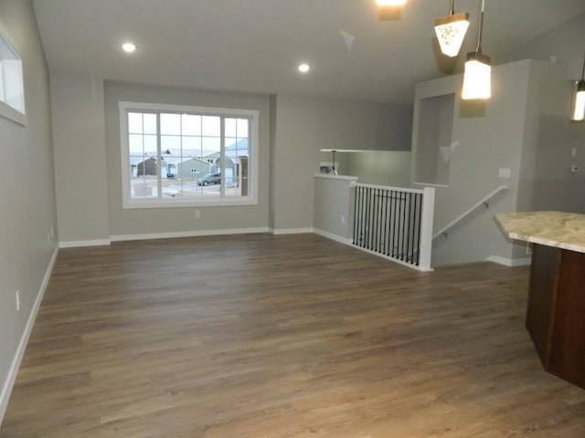 spare room featuring dark wood-type flooring