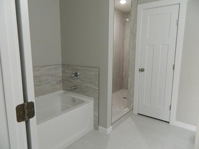 bathroom with tile patterned floors and plus walk in shower