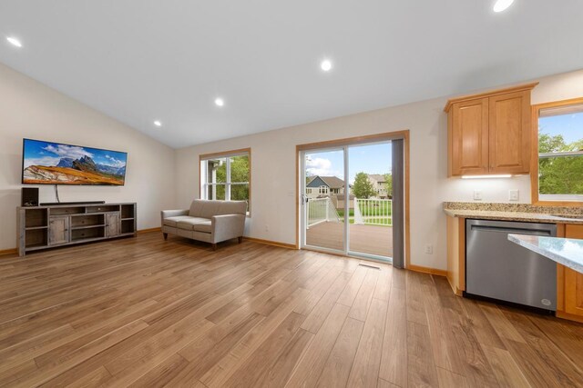 1939 Legacy Dr, Faribault, MN 55021 - unfurnished living room with light wood-style floors, recessed lighting, vaulted ceiling, and baseboards
