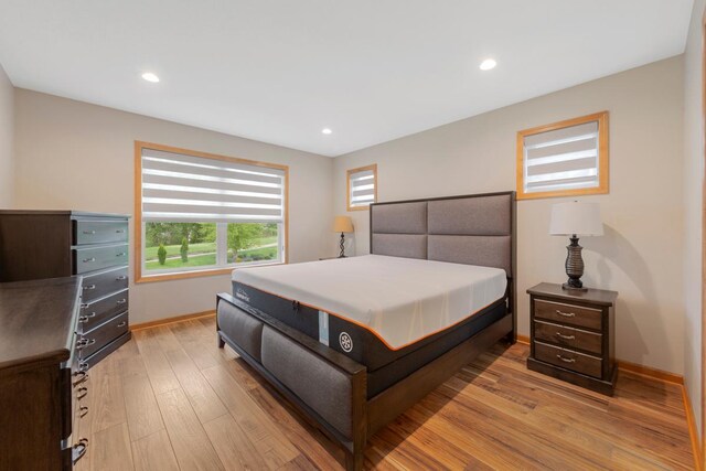 1939 Legacy Dr, Faribault, MN 55021 - bedroom with light wood-type flooring, baseboards, and recessed lighting