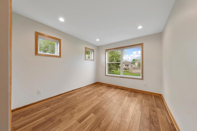 1939 Legacy Dr, Faribault, MN 55021 - unfurnished room with light wood-type flooring, baseboards, and recessed lighting