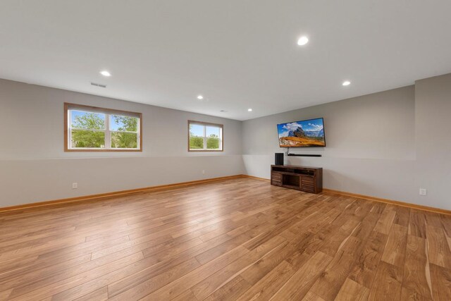 1939 Legacy Dr, Faribault, MN 55021 - unfurnished living room featuring light wood-style floors, baseboards, and recessed lighting