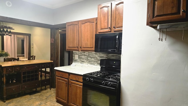 kitchen featuring decorative backsplash and black appliances