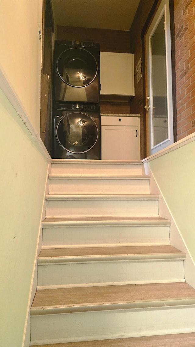 stairway with stacked washer / dryer