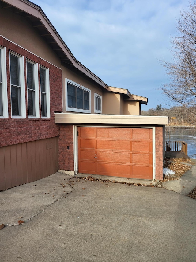 view of side of home with a garage