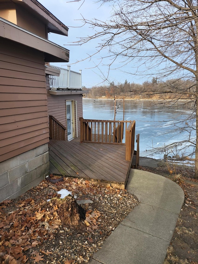 wooden deck featuring a water view