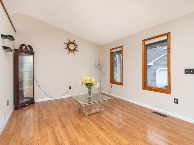 empty room with light hardwood / wood-style flooring